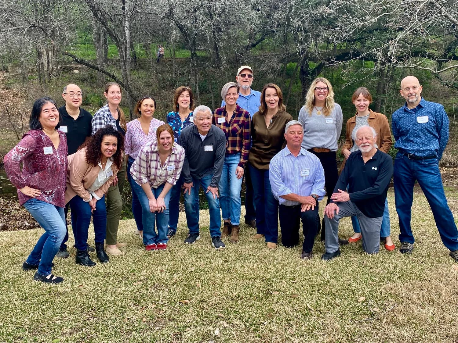 The Zilker 351 board and staff gathered together outdoors in the park