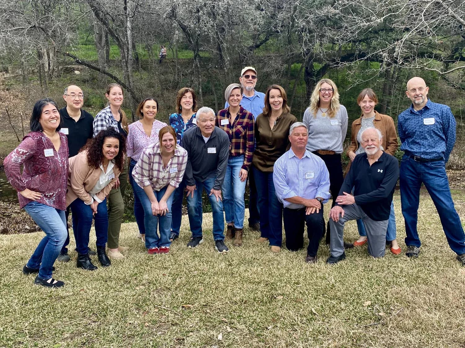 The Zilker 351 board and staff gathered together outdoors in the park
