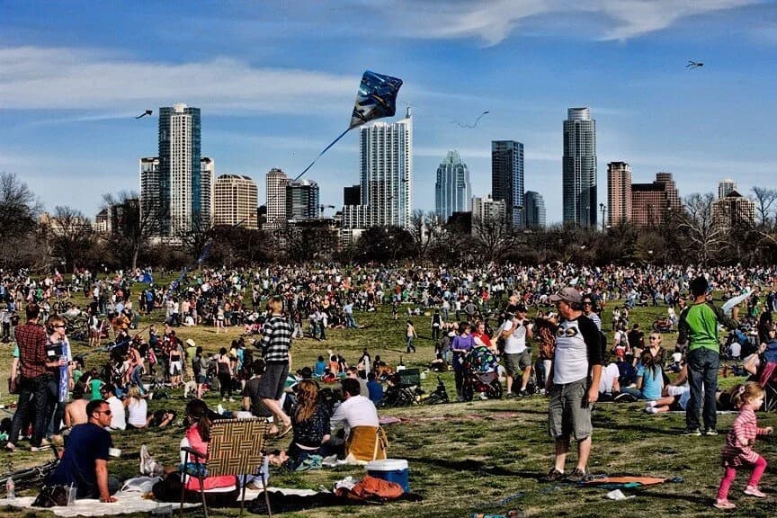 A crowd spread across the great lawn flying kites during the Kite Festival