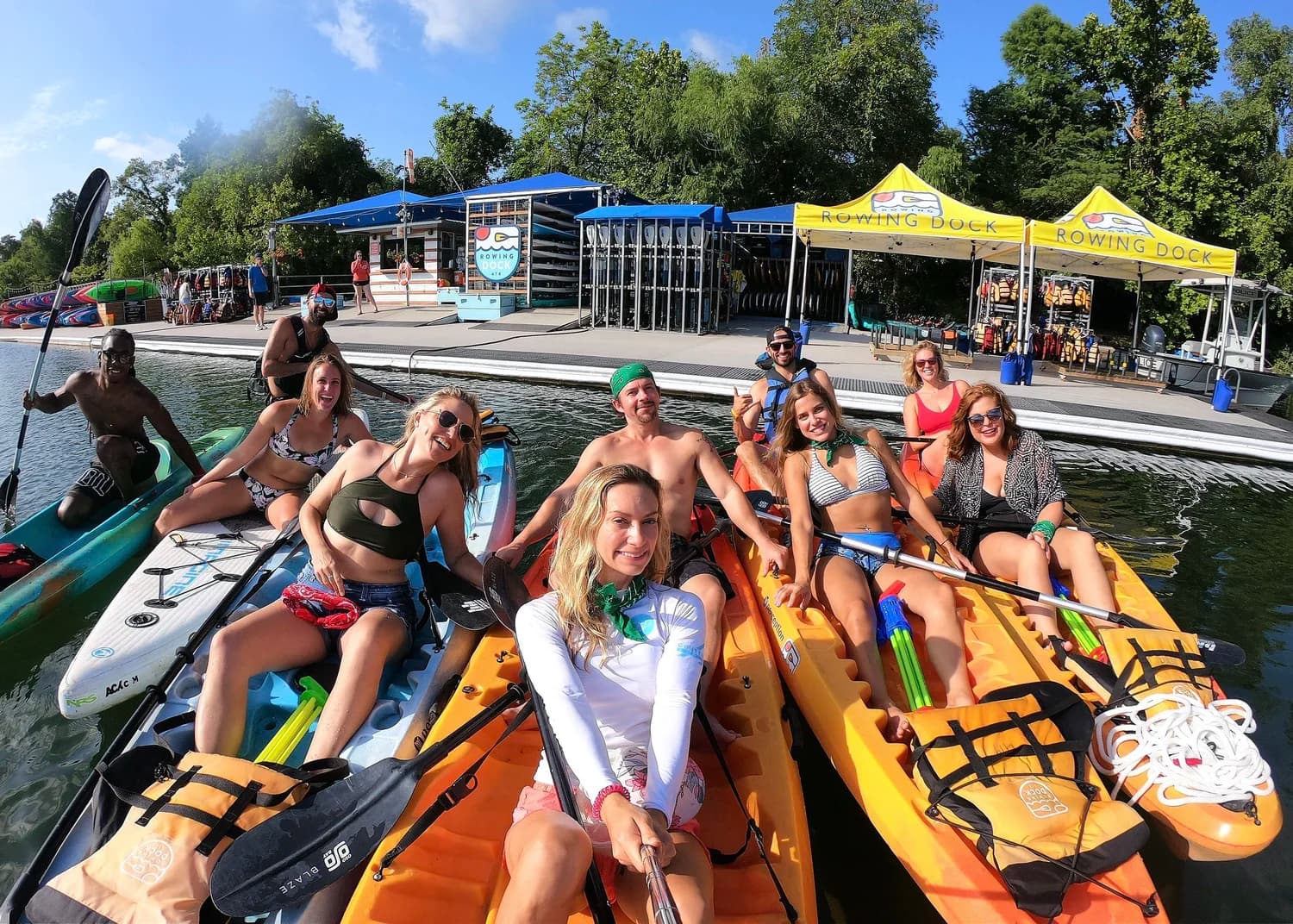 A group of paddlers gathered on the water at the Rowing Dock in Zilker Park