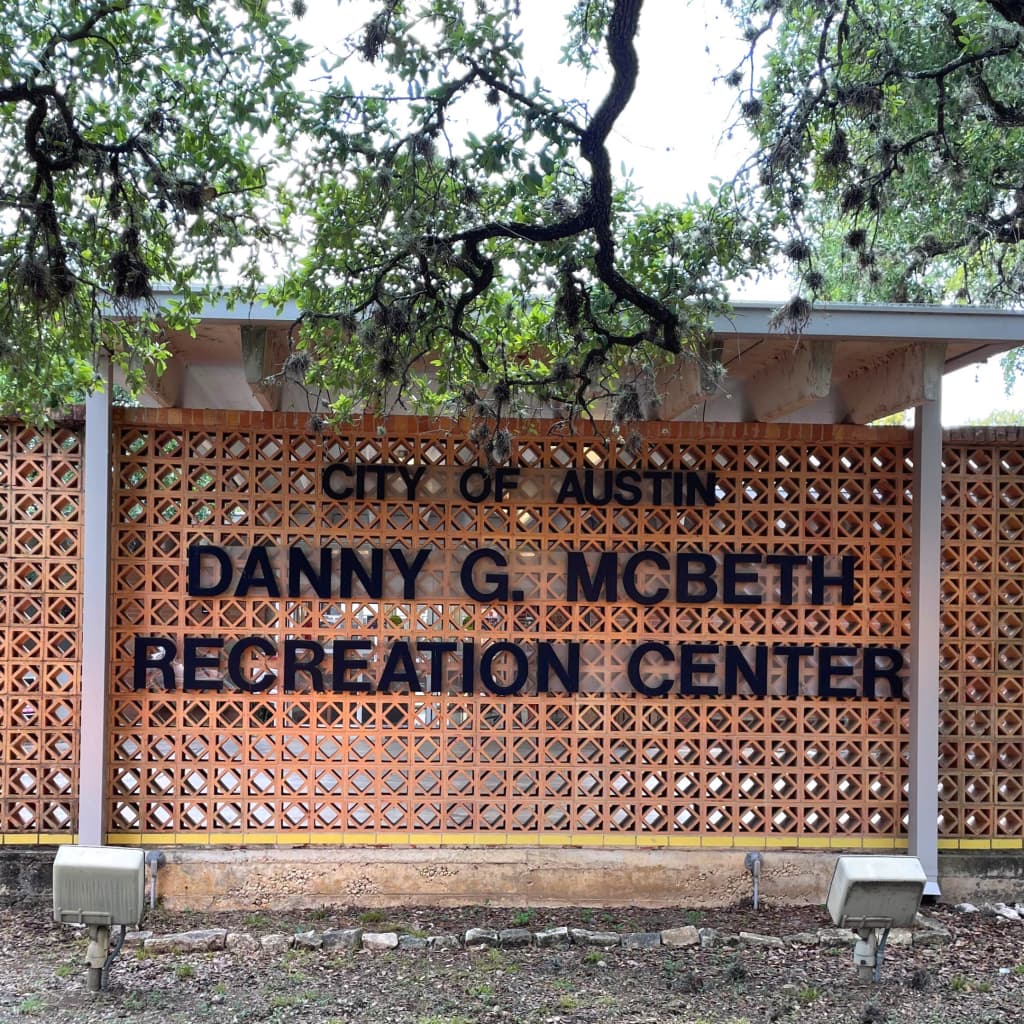 The carved-stone entrance sign for the City of Austin Danny G. McBeth Recreation Center