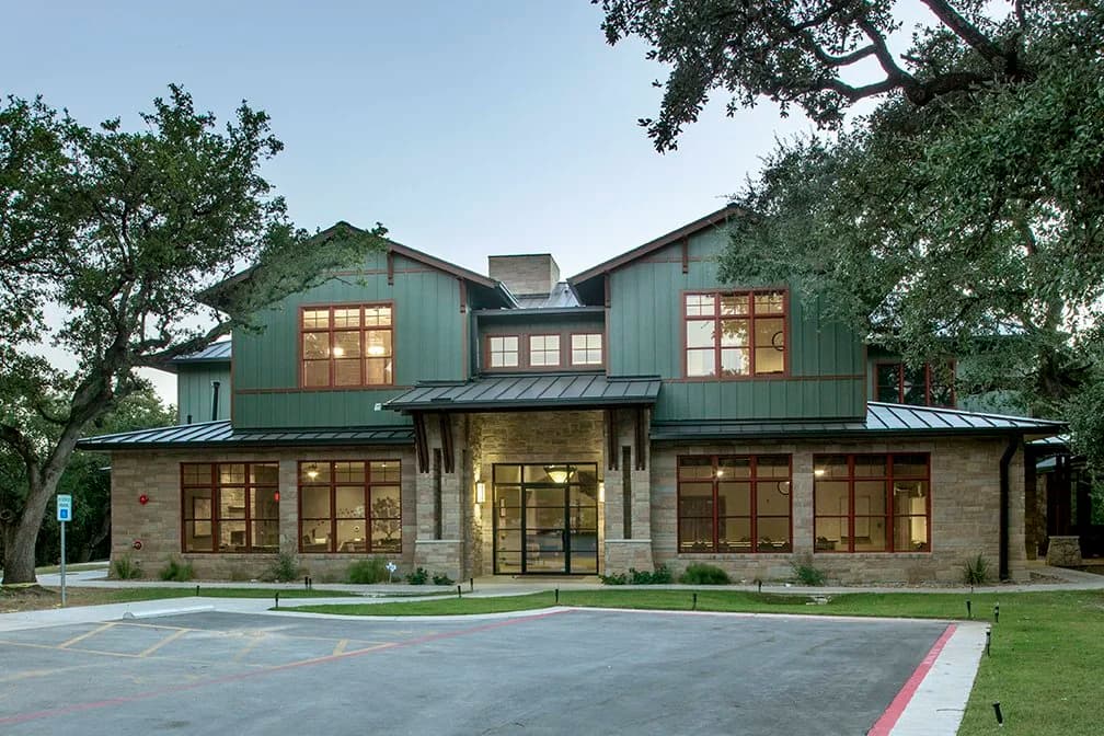 The Hill Country–style Zilker Lodge building among the trees